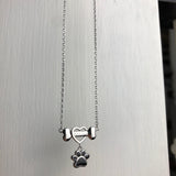 Нежно колие с лапа на куче, изработено от неръждаема стомана