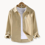 Риза - Предна част с копчета, дълъг кройка и гъвкаво и дишающе регулиране